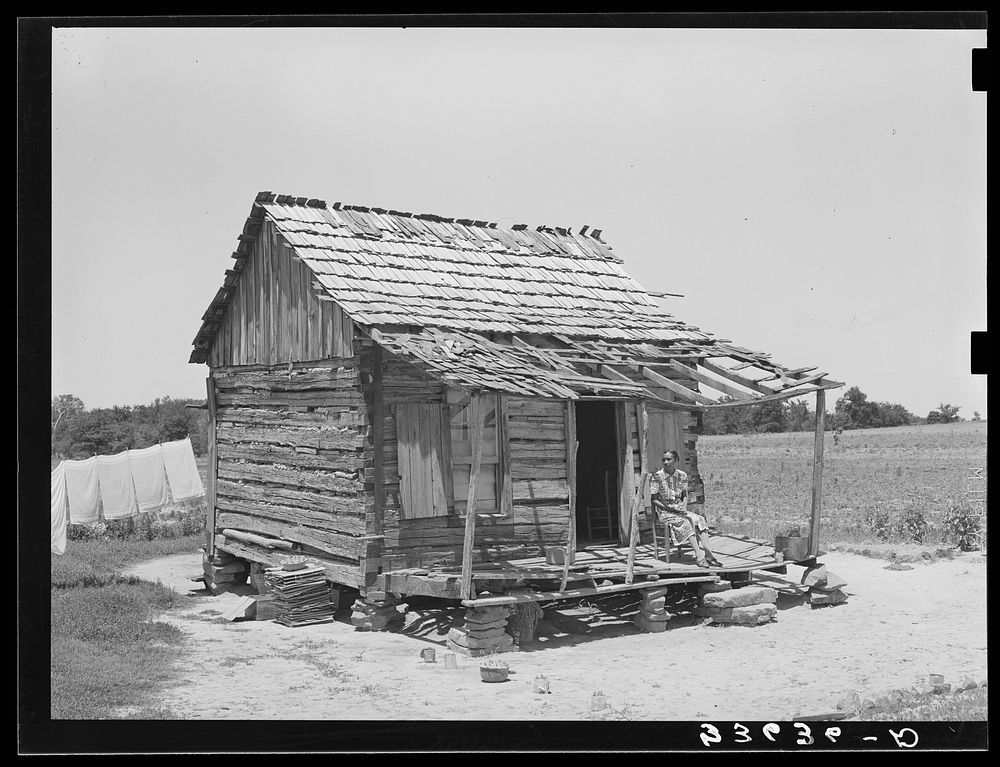 Home of  agricultural day laborers in Arkansas River bottoms. Near Vian, Oklahoma, Sequoyah County by Russell Lee