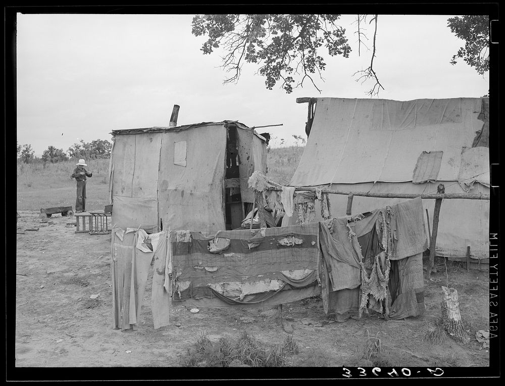 Clothes and tent of itinerant statue maker and agricultural day laborer living on Poteau Creek near Spiro, Oklahoma.…