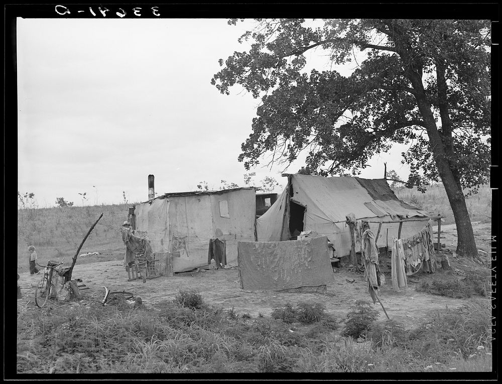 Home of itinerant statue maker and agricultural day laborer living in Poteau Creek, near Spiro, Oklahoma. Sequoyah County by…