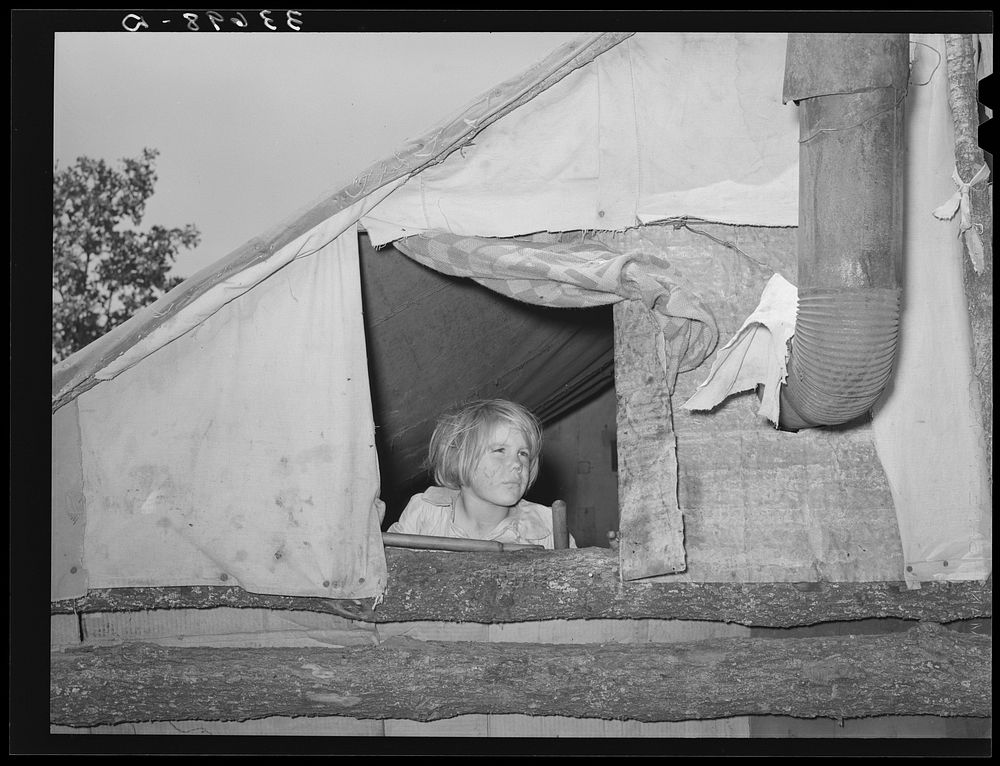Child looking out of window of tent home near Sallisaw, Oklahoma. Sequoyah County by Russell Lee