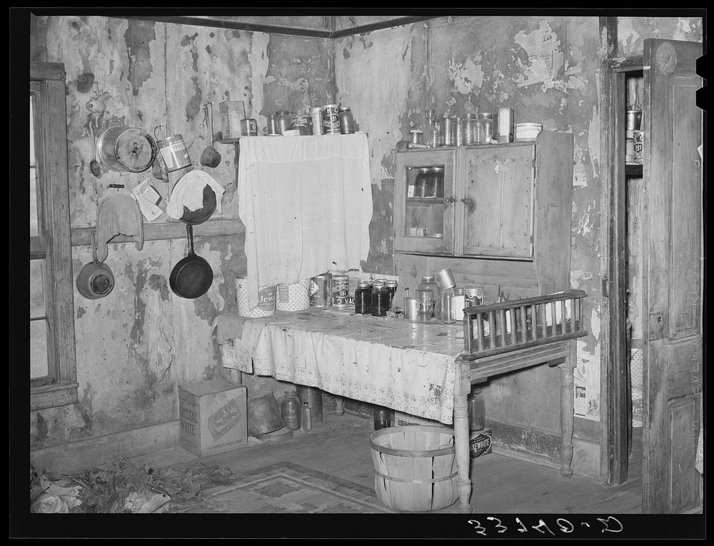 Kitchen in home of  agricultural day laborer living in small town in Muskogee County, Oklahoma by Russell Lee
