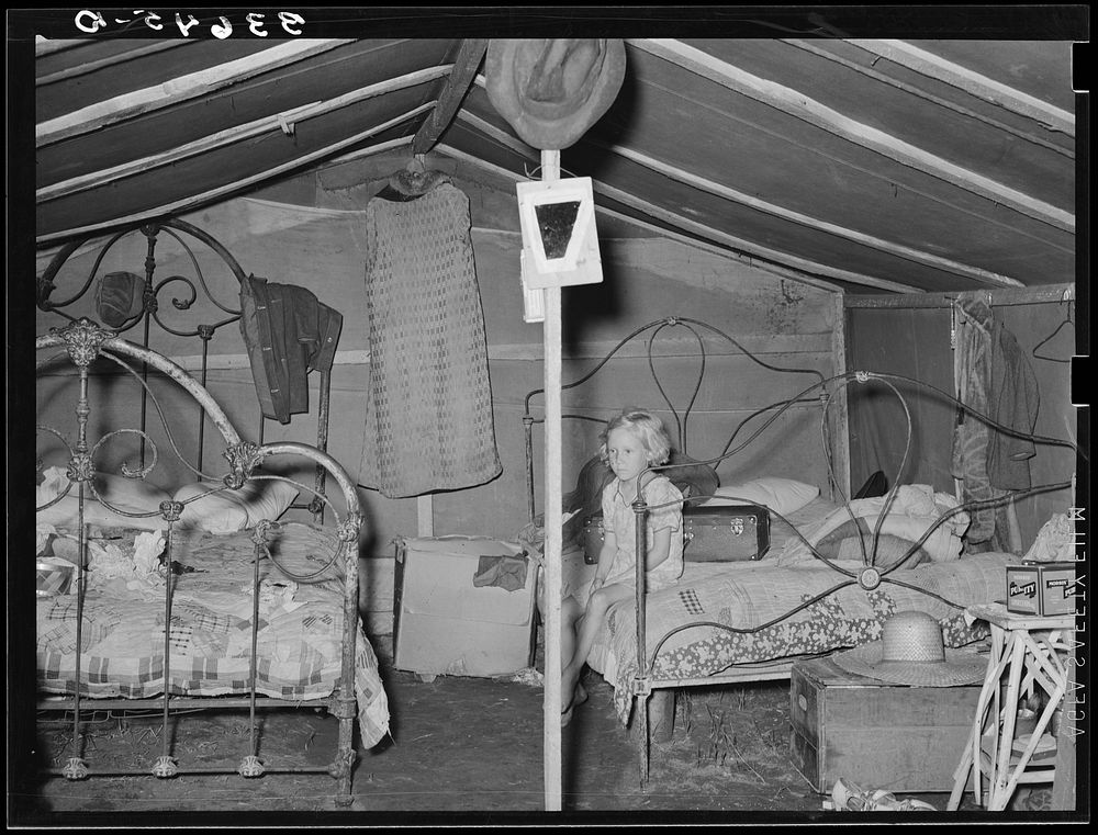 Child of agricultural day laborer in tent home near Spiro, Oklahoma. Sequoyah County by Russell Lee