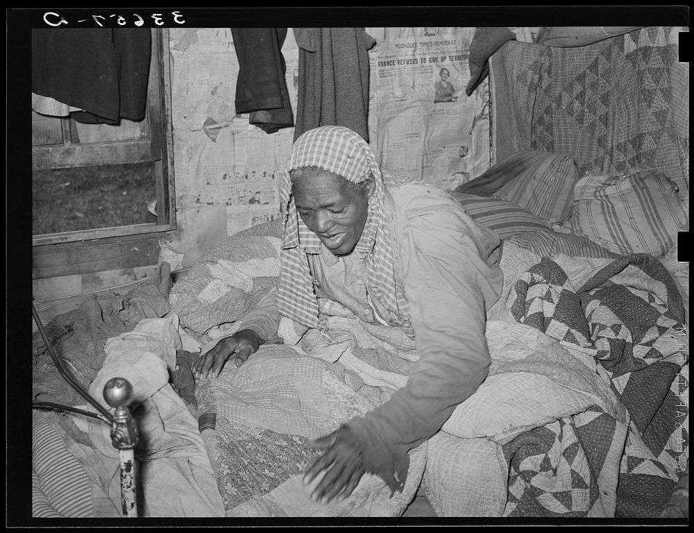 [Untitled photo, possibly related to: Old Negress, wife of agricultural day laborer, in bed with rheumatism. Wagoner County…