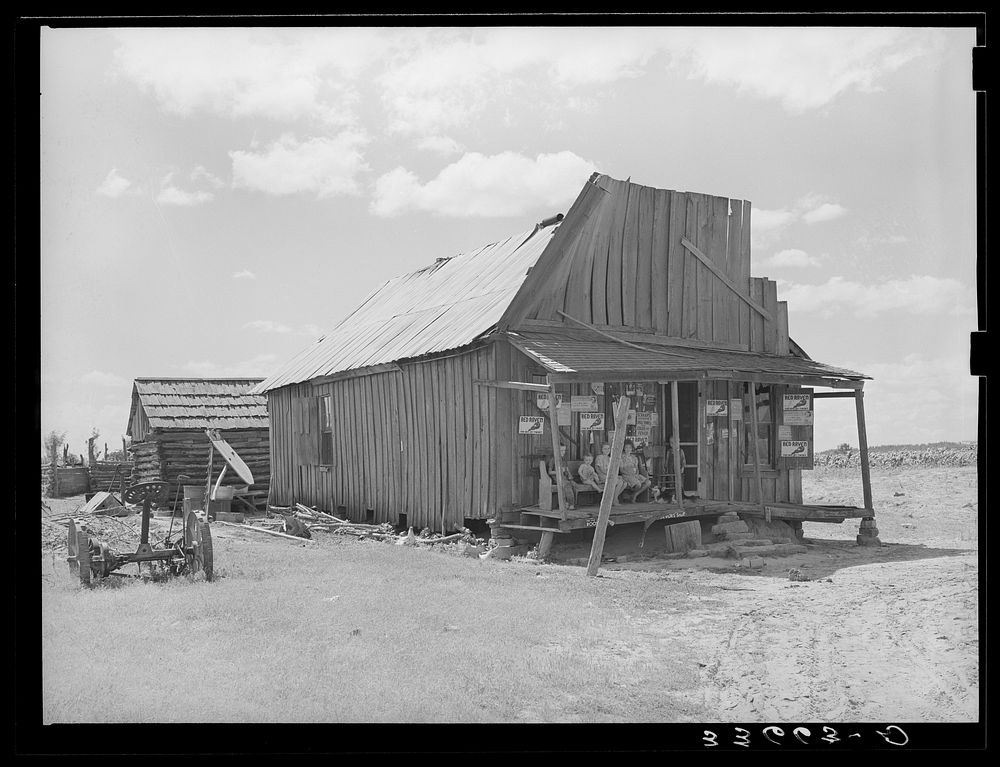 Old grocery store serving an agricultural community in the Arkansas River bottoms near Vian, Oklahoma by Russell Lee