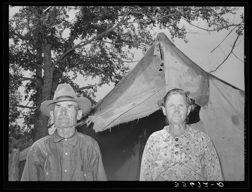 Old couple who have moved into tent home near Sallisaw, Oklahoma, in order to save rent and cost of wood in town by Russell…