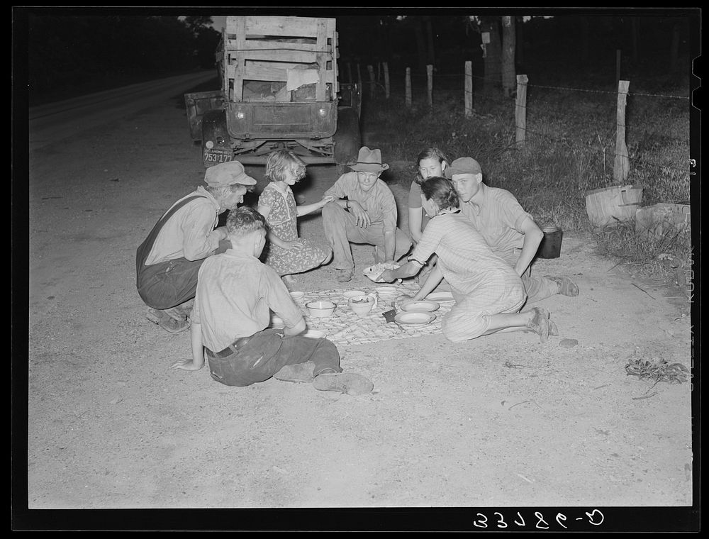 [Untitled photo, possibly related to: Migrant family encamped along roadside eating meal. Near Henryetta, Oklahoma] by…
