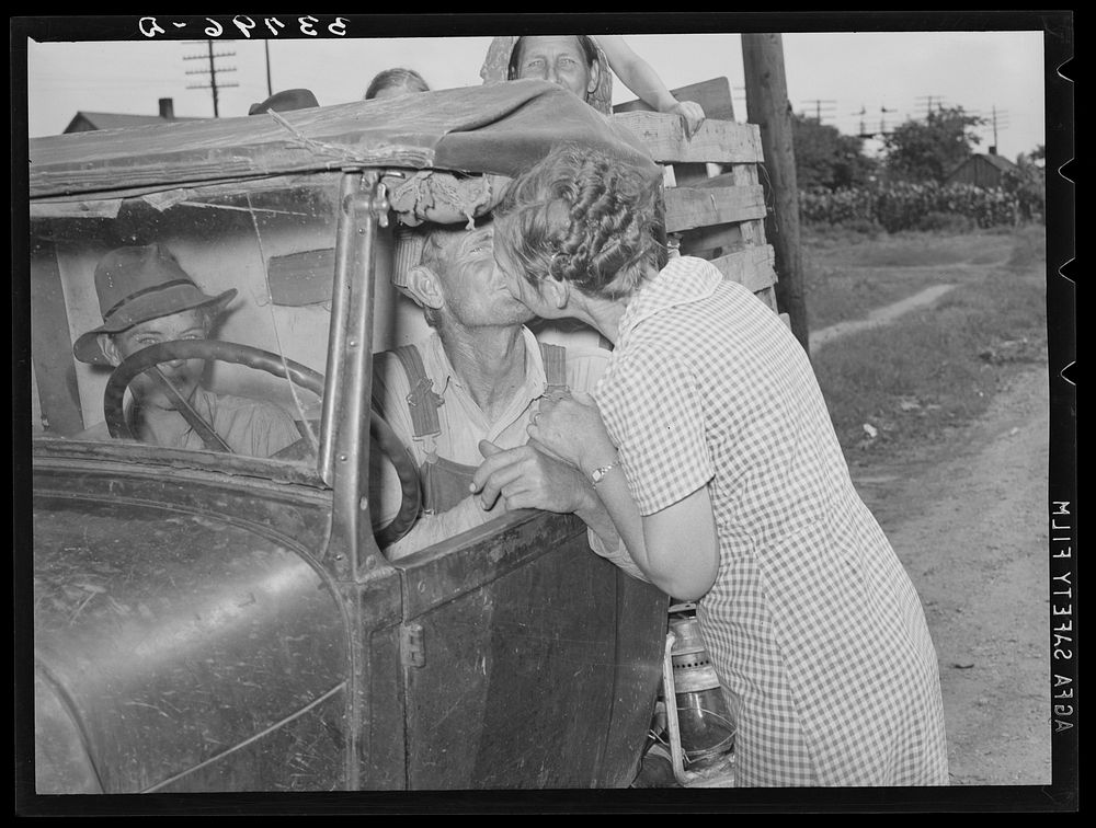 Kissing a relative goodbye. Muskogee, Oklahoma. Migrant family bound for California by Russell Lee