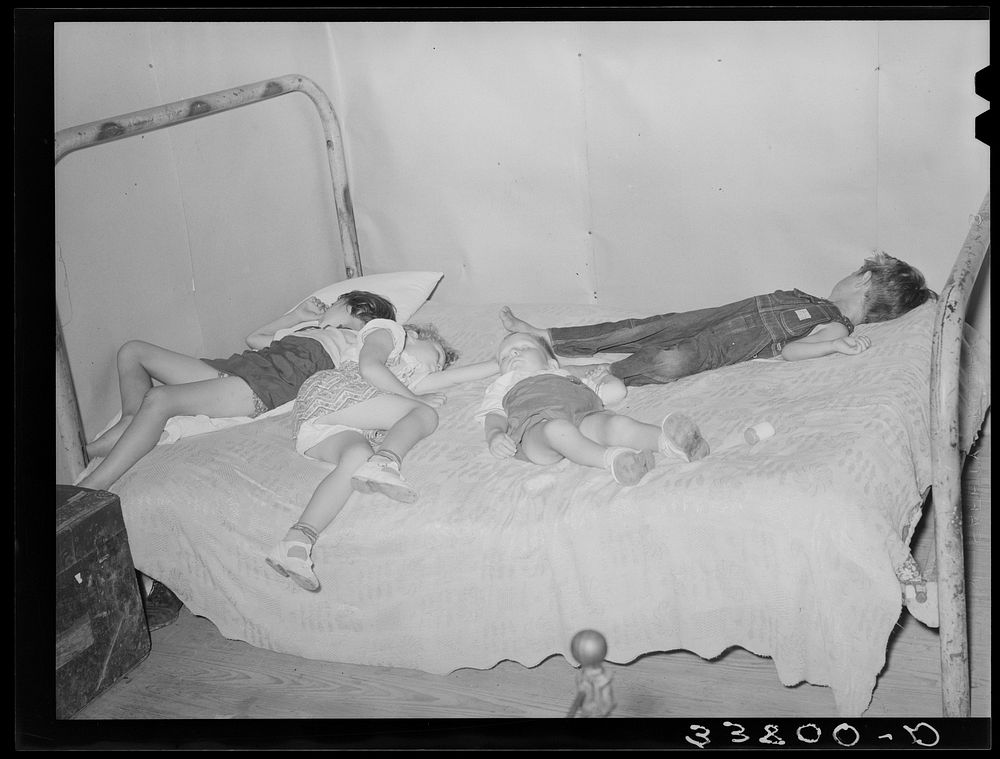 Children asleep on bed at square dance in hills near McAlester on Saturday night in home of sharecropper. Oklahoma…