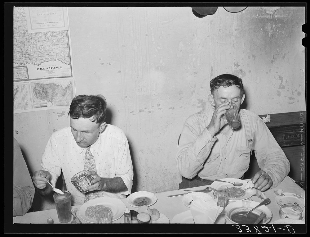 Man eating dinner at family-style restaurant. Muskogee, Oklahoma by Russell Lee