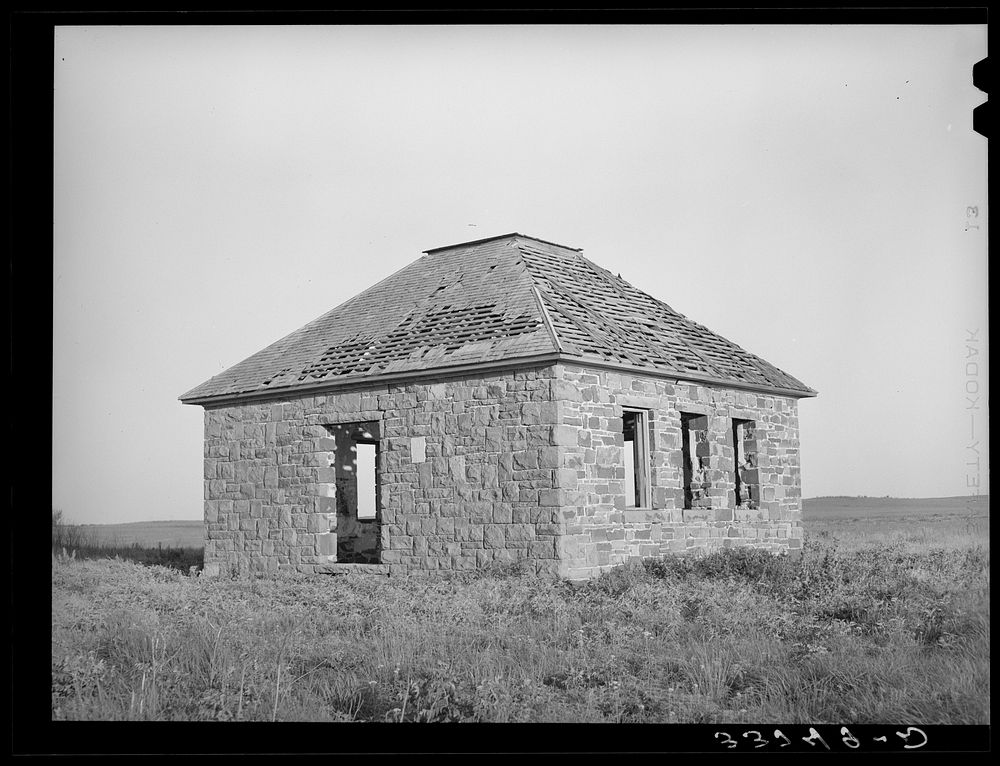 Abandoned brick schoolhouse. McIntosh County, Oklahoma. The tendency is towards consolidation of county schools by Russell…