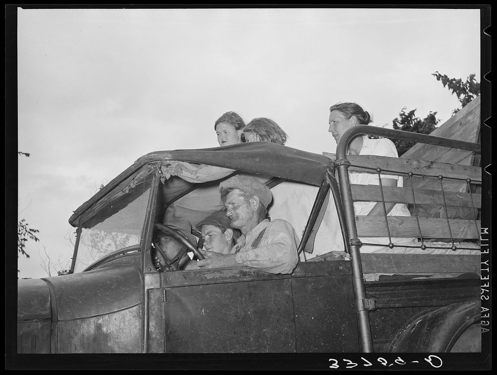 Migrant family in car enroute to California. Near Muskogee, Oklahoma by Russell Lee