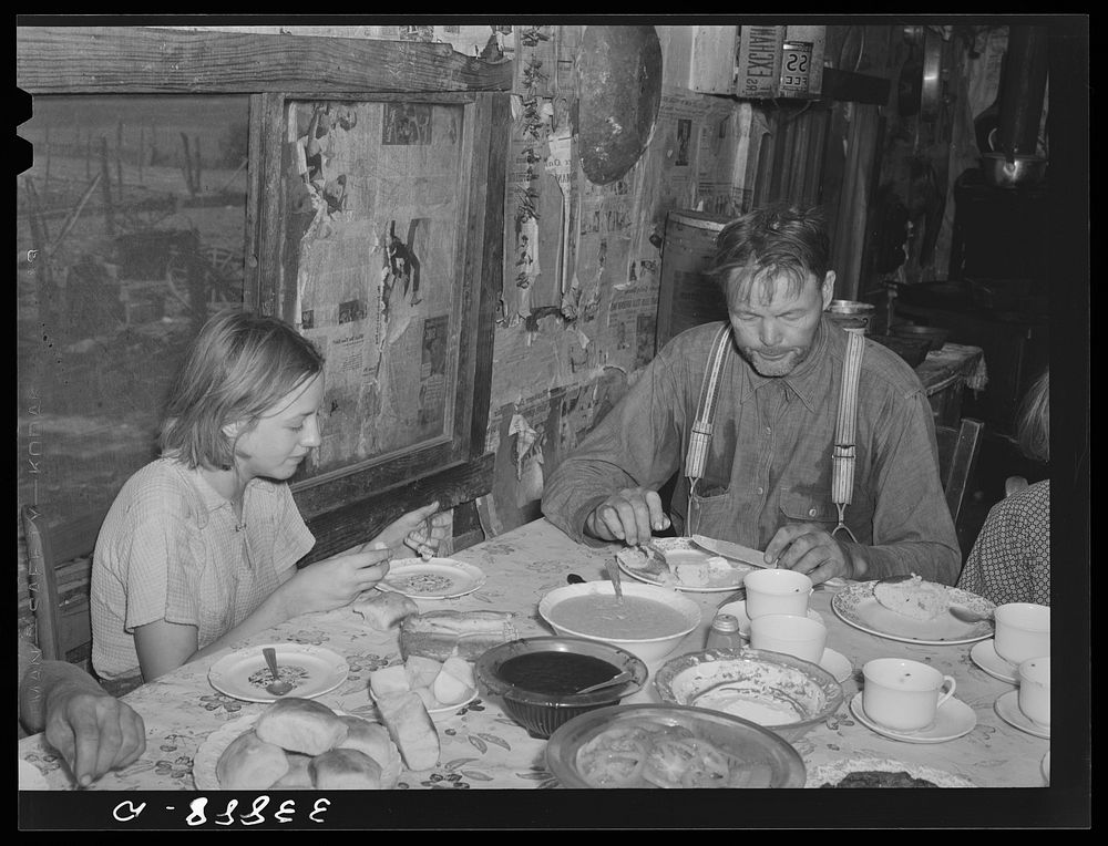 Tenant farmer and daughter at noonday meal. Near Muskogee, Oklahoma. See general caption number 20 by Russell Lee