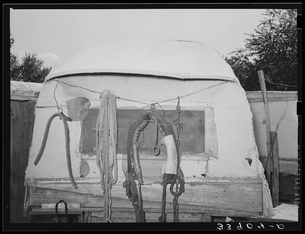 Harness and rope on back of covered trailer in Mays Avenue camp. Oklahoma City, Oklahoma by Russell Lee