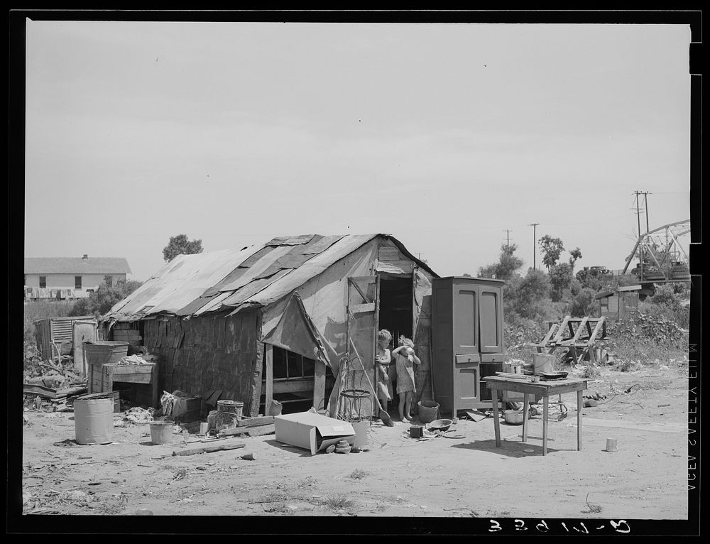 Shack of family living in Mays Avenue camp. Oklahoma City, Oklahoma. See general caption no. 21 by Russell Lee