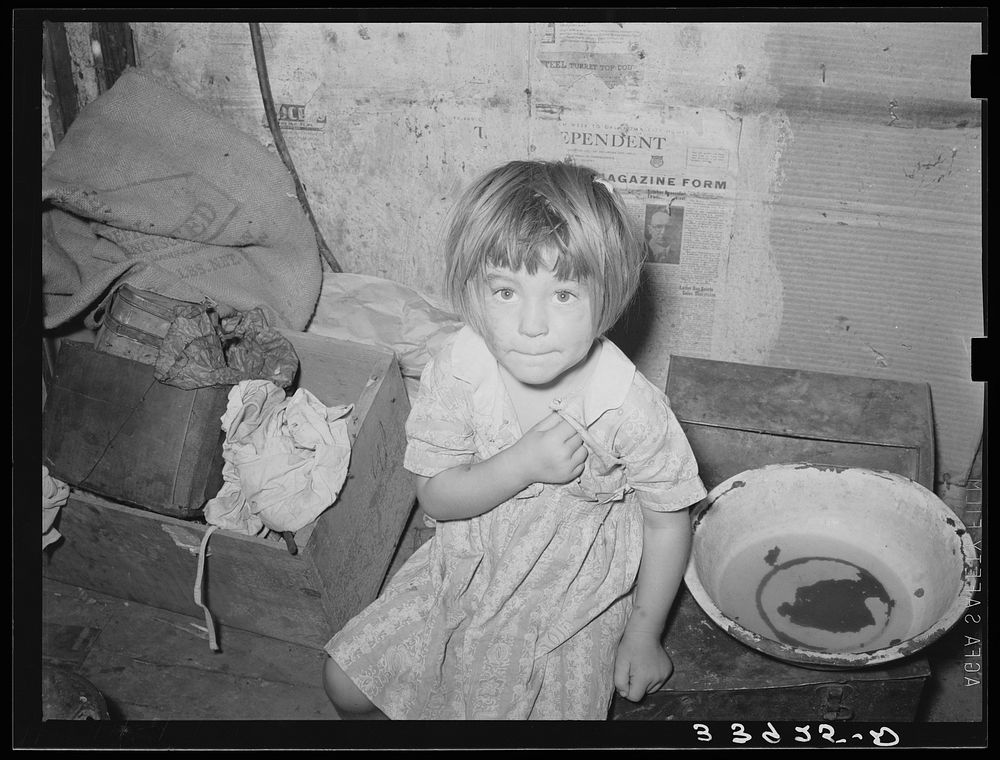 Little girl in shack home in camp near Mays Avenue. Oklahoma City, Oklahoma. See general caption no. 21 by Russell Lee