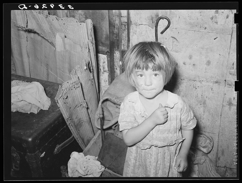[Untitled photo, possibly related to: Little girl in shack home in camp near Mays Avenue. Oklahoma City, Oklahoma. See…