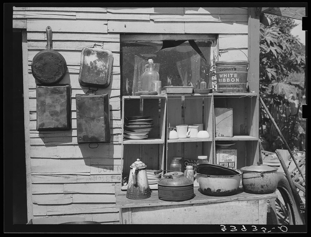 Pans and outdoor kitchen cupboard of family living near Mays Avenue camp. Oklahoma City, Oklahoma. See general caption no.…