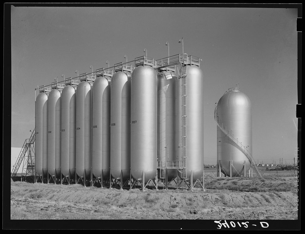 Gas tanks in oil field. Oklahoma City, Oklahoma by Russell Lee