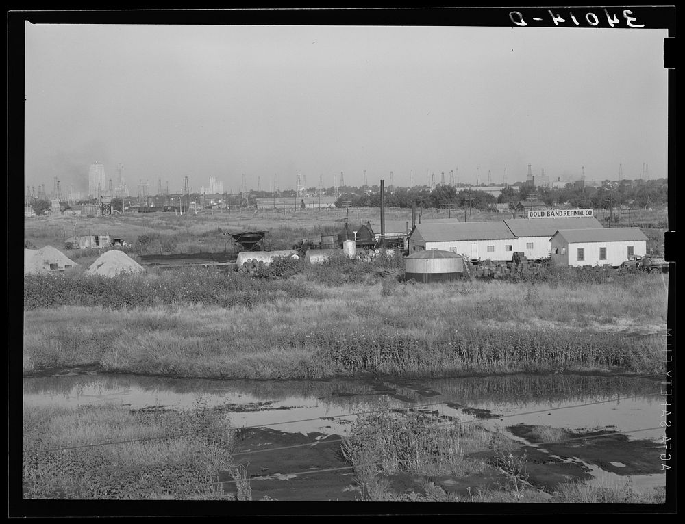 [Untitled photo, possibly related to: Independent refinery. Business section of Oklahoma City, Oklahoma in background] by…