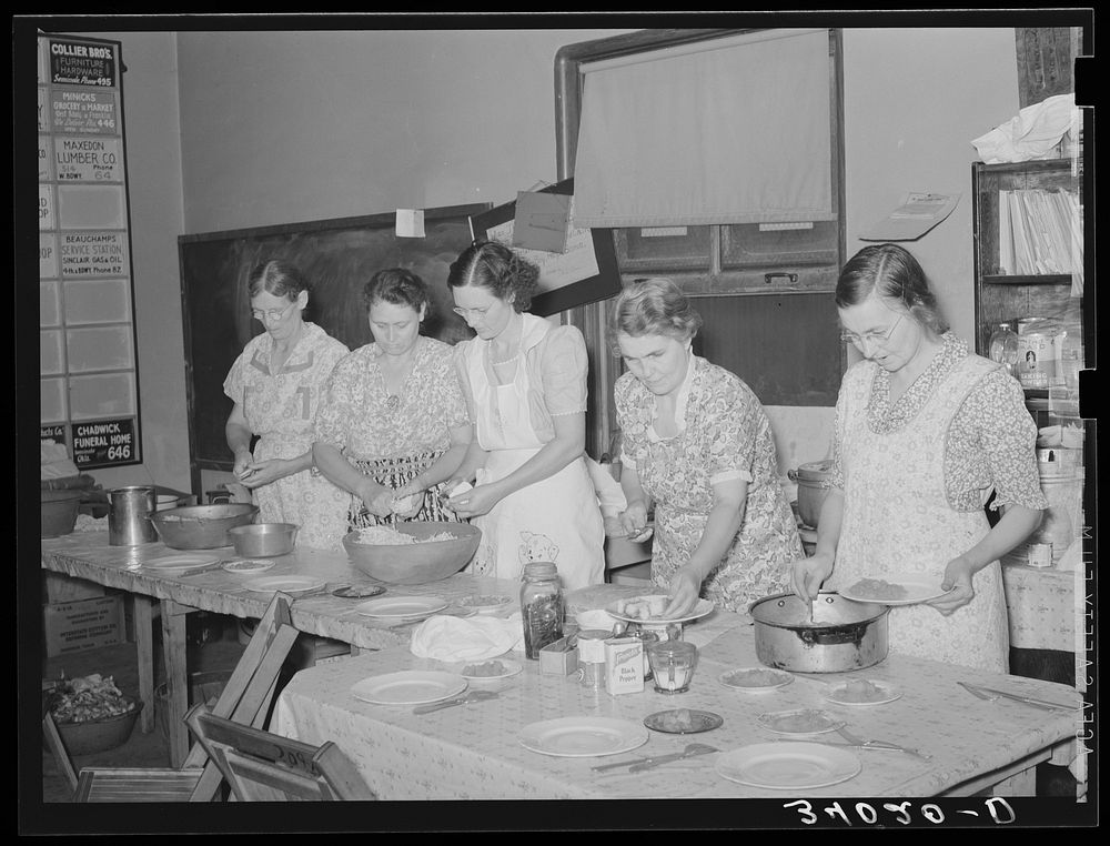 Wives of striking members of oil workers union preparing lunch for picketers. Seminole, Oklahoma by Russell Lee