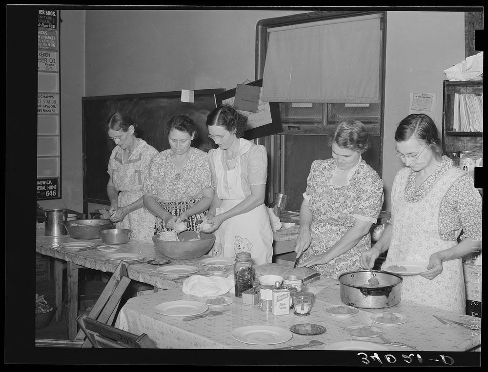 [Untitled photo, possibly related to: Wives of striking members of oil workers union preparing lunch for picketers.…