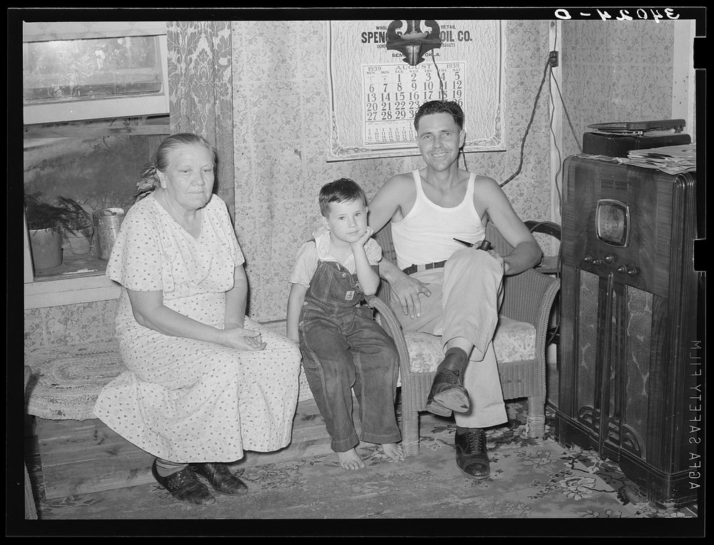 Truck driver, his mother and son at home. Seminole, Oklahoma, oil fields by Russell Lee