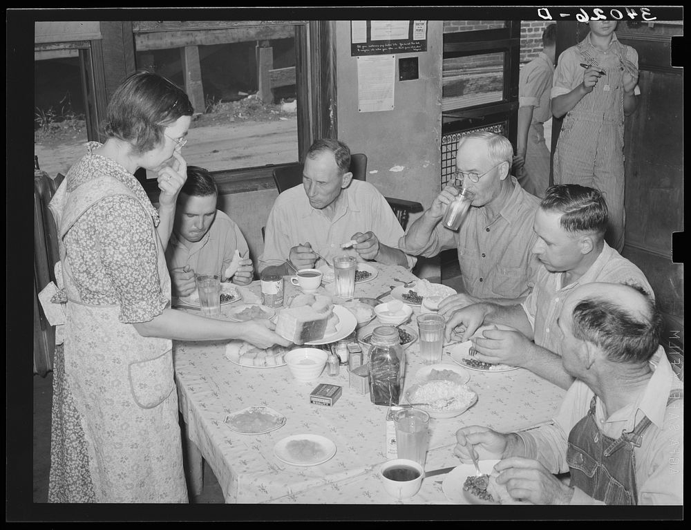 Pickets of striking oil workers' union eating lunch prepared by their wives at union headquarters. Seminole, Oklahoma by…