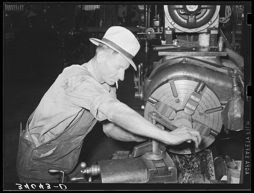 Machinist working at lathe. Seminole, Oklahoma, oil refinery by Russell Lee