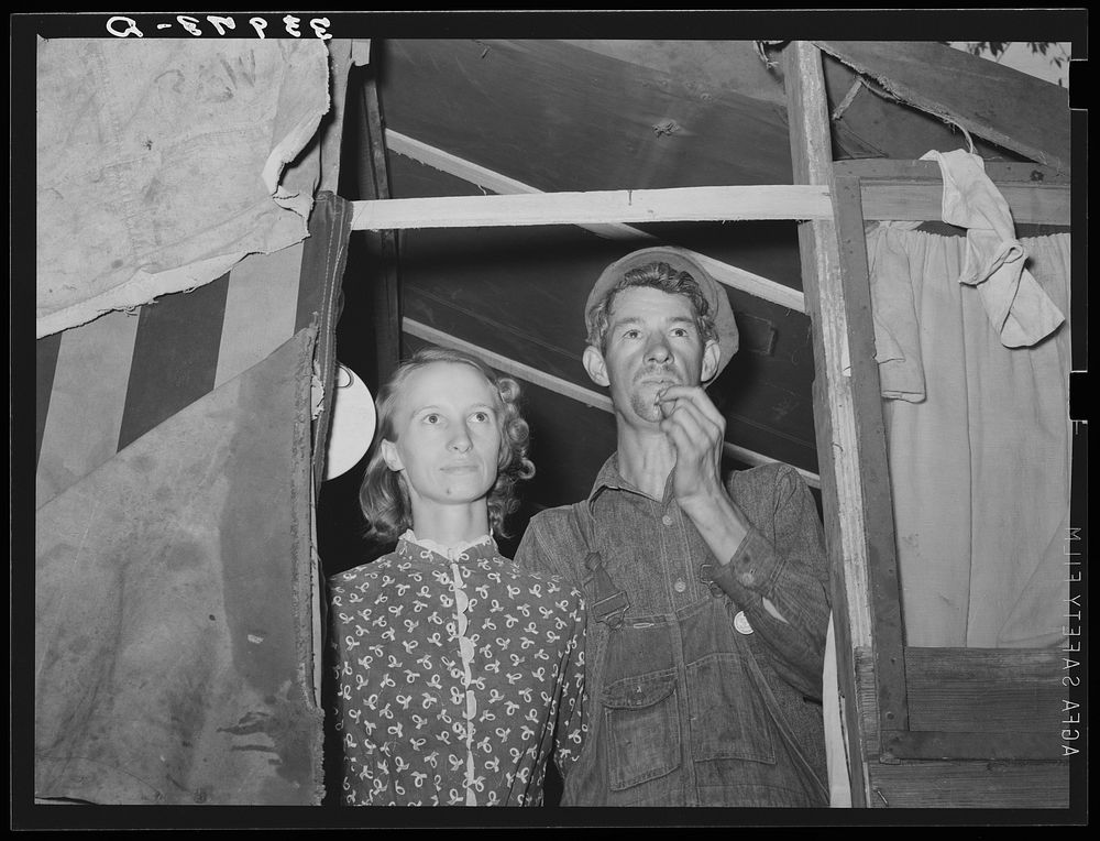 Young couple in doorway of their tent home. Community camp, Oklahoma City, Oklahoma. See general caption 21 by Russell Lee