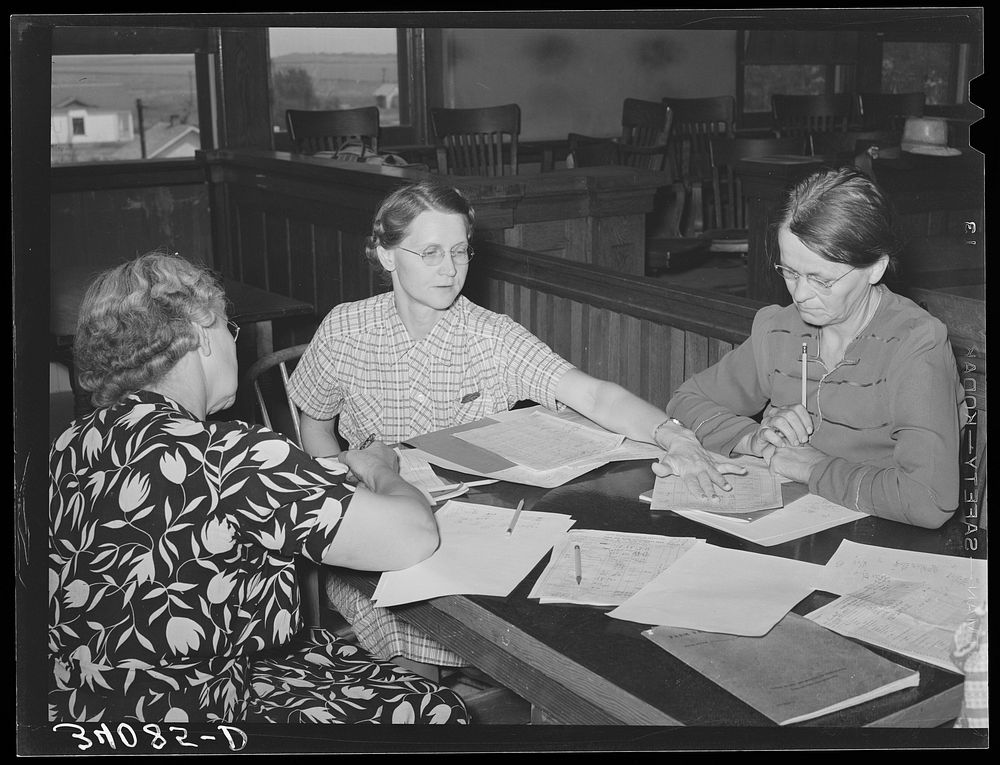 FSA (Farm Security Administration) home supervisor explaining home plan to clients. Sheridan County, Kansas by Russell Lee