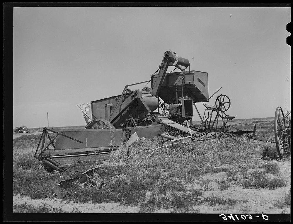 Old combine, unused for several years, near Cimarron, Kansas. Gray County by Russell Lee