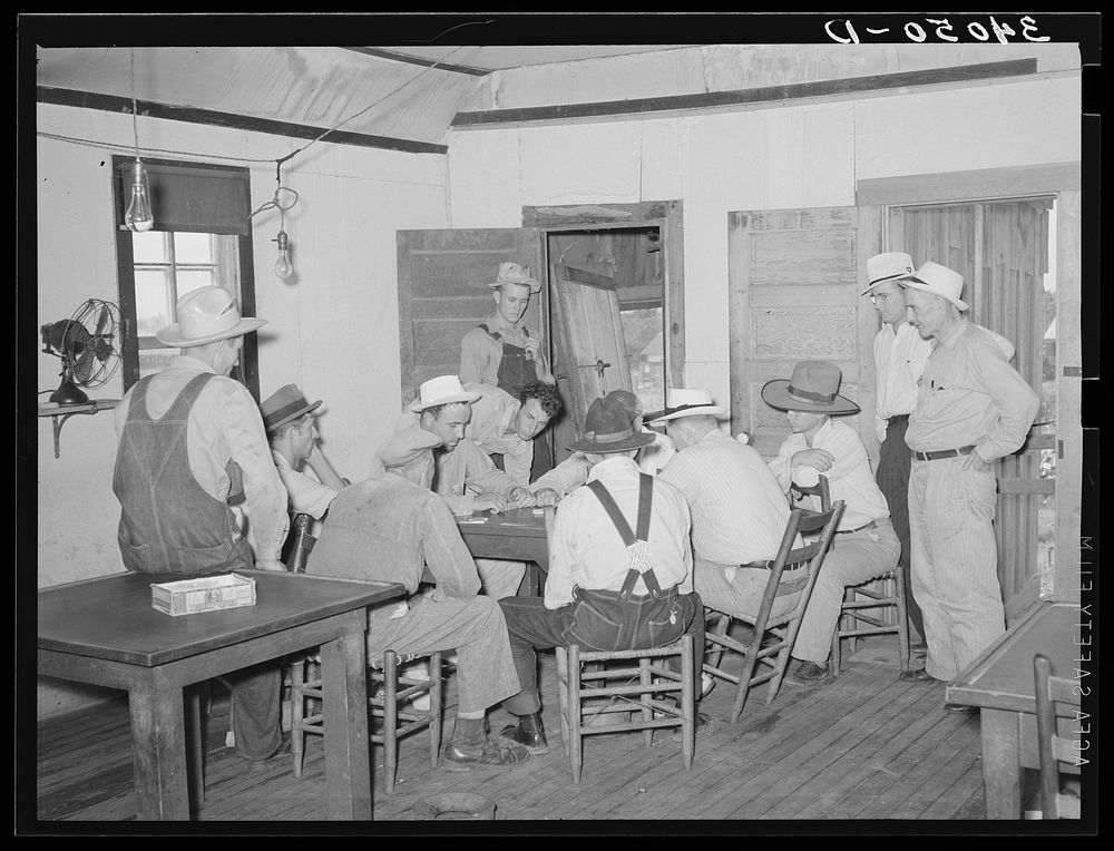 Game of dominoes in back room of bar. Saint Louis, Oklahoma. Oil field workers by Russell Lee