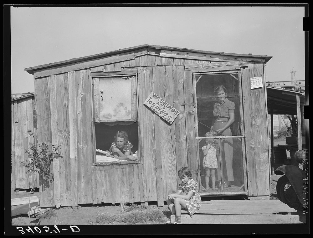 Home and family of oil field roustabout. Oklahoma City, Oklahoma. During periods of unemployment the woman takes in washing…
