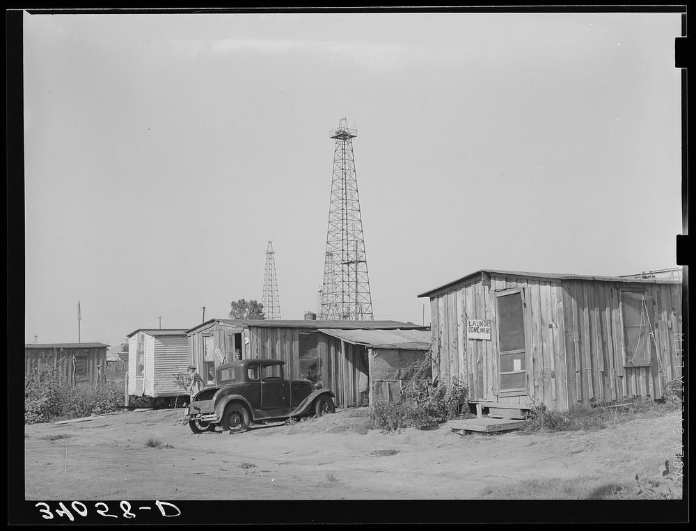 Homes of oil field workers. Oklahoma City, Oklahoma. During periods of unemployment laundry work is done by Russell Lee