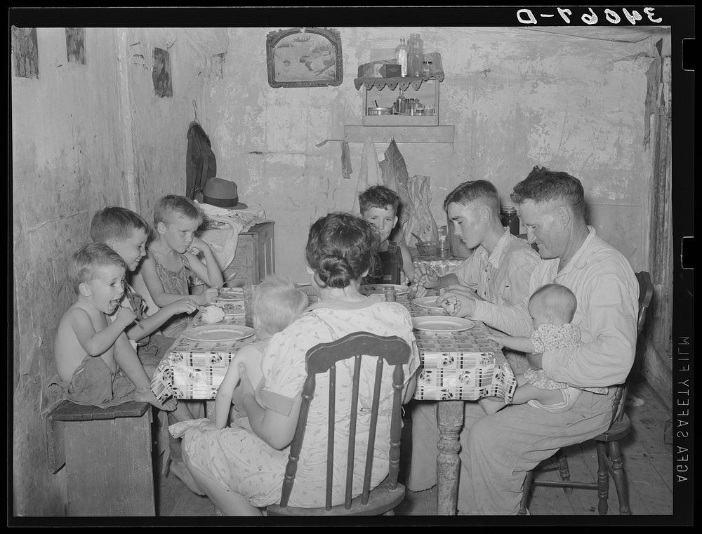 Family of unemployed oil worker, who is now living on relief, eating supper. Seminole, Oklahoma by Russell Lee