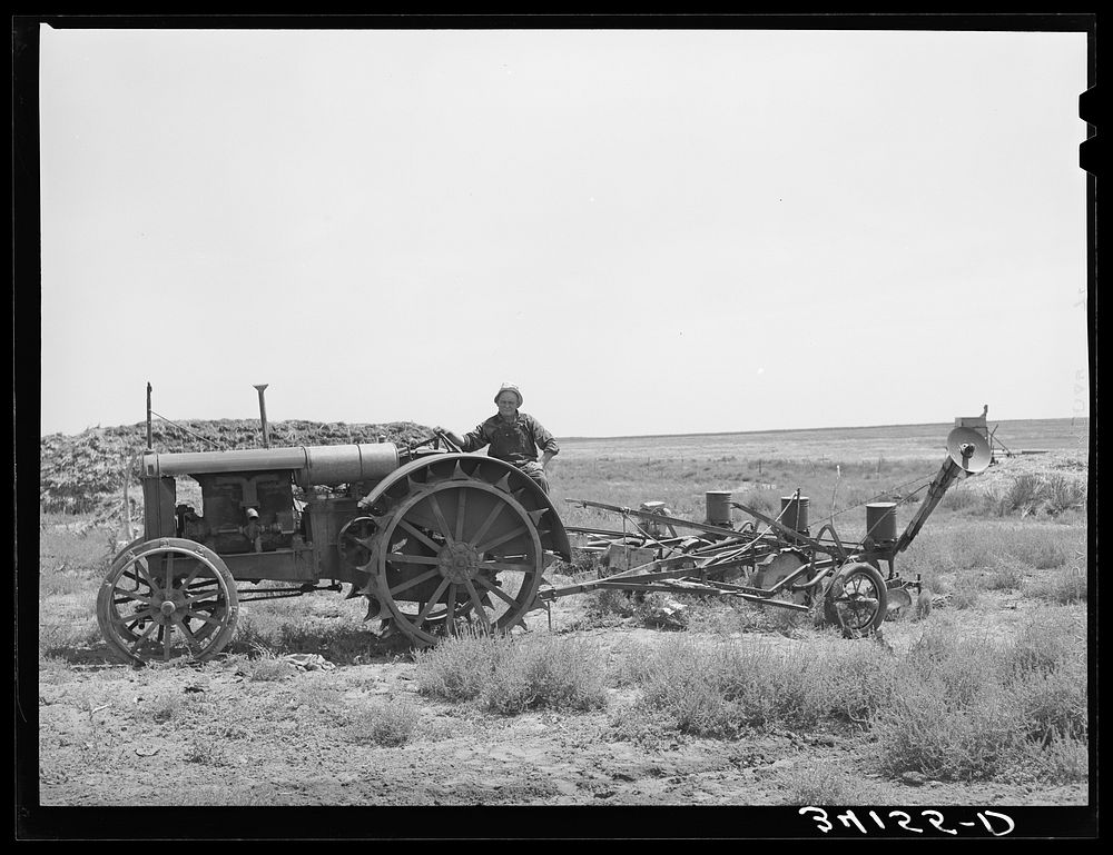Mr. Bosley on his tractor and planter on the Bosley reorganization unit. Baca County, Colorado by Russell Lee