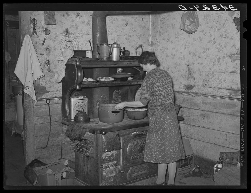 Preparing dinner in farm home of FSA (Farm Security Administration) client near Bradford, Vermont. Orange County by Russell…