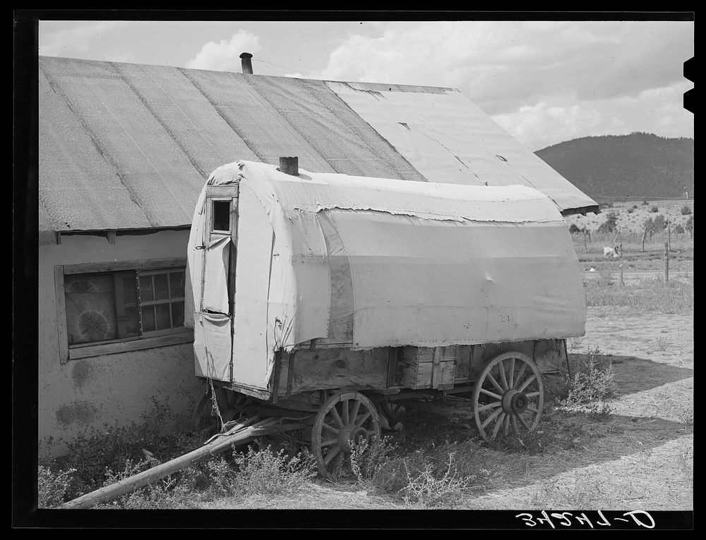 Old sheepherder's wagon near, Questa, New Mexico by Russell Lee