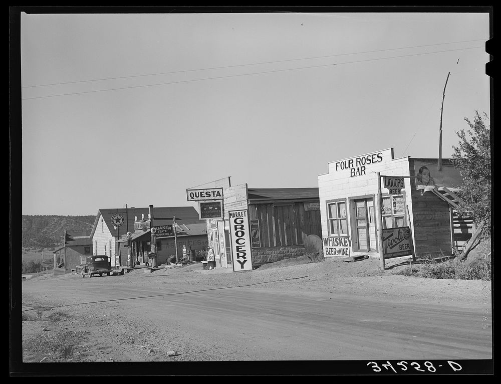 Street scene. Questa, New Mexico by Russell Lee