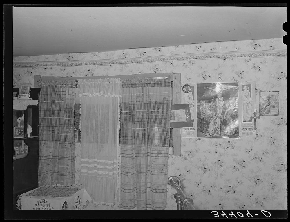 [Untitled photo, possibly related to: Sideboard weighed down with photographs in Spanish-American home in Taos County, New…