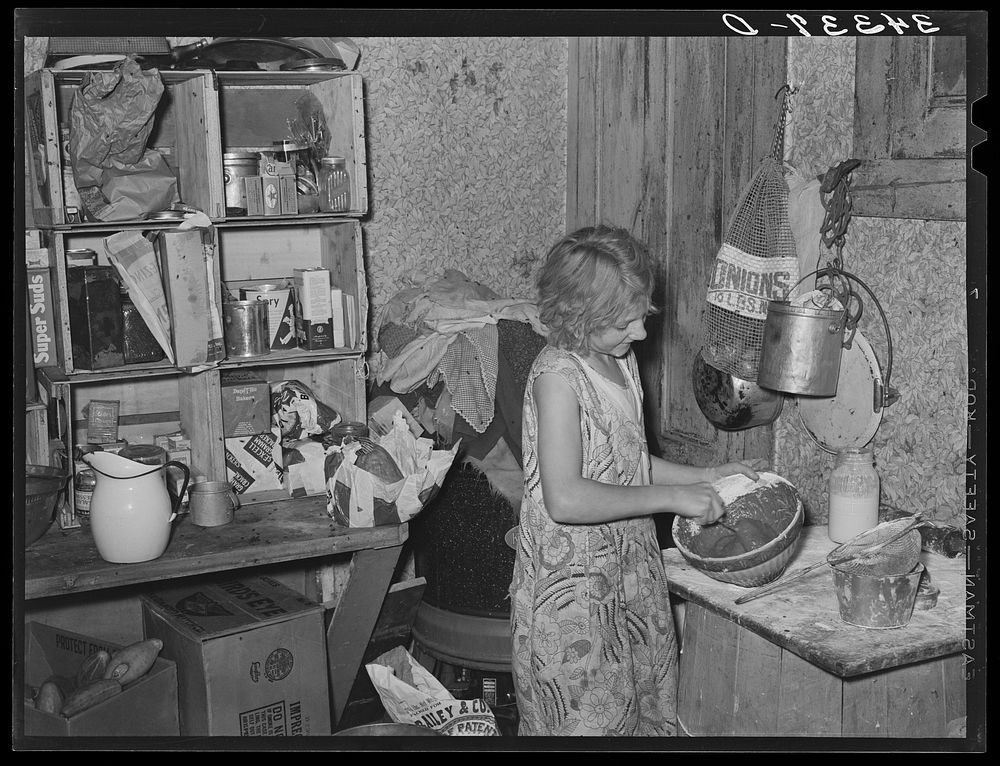 Daughter of FSA (Farm Security Administration) client mixing a cake. Farm near Bradford, Vermont. Orange County by Russell…