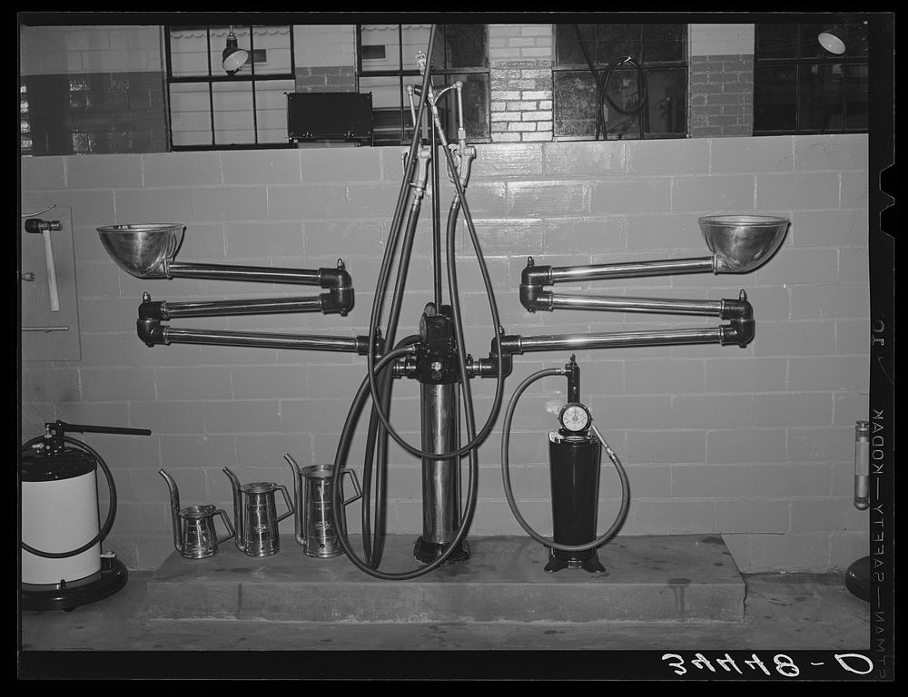 Lubrication equipment in gasoline service station. Victoria, Texas by Russell Lee