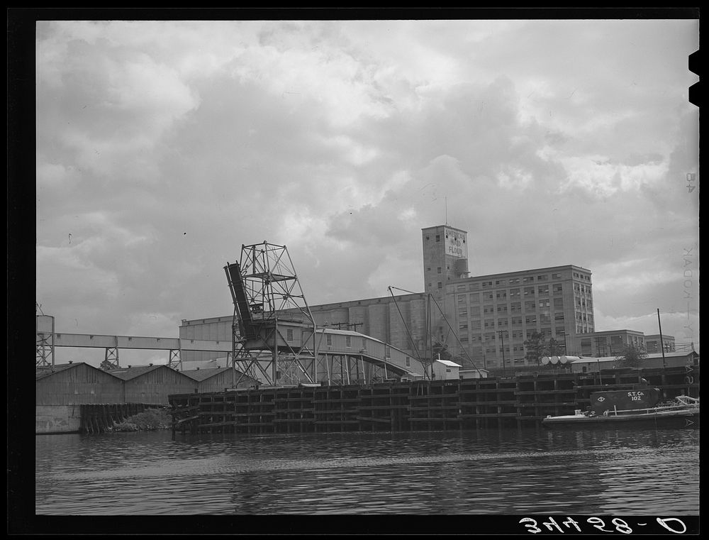 Flour mill and coal loading dock. Port of Houston, Texas by Russell Lee