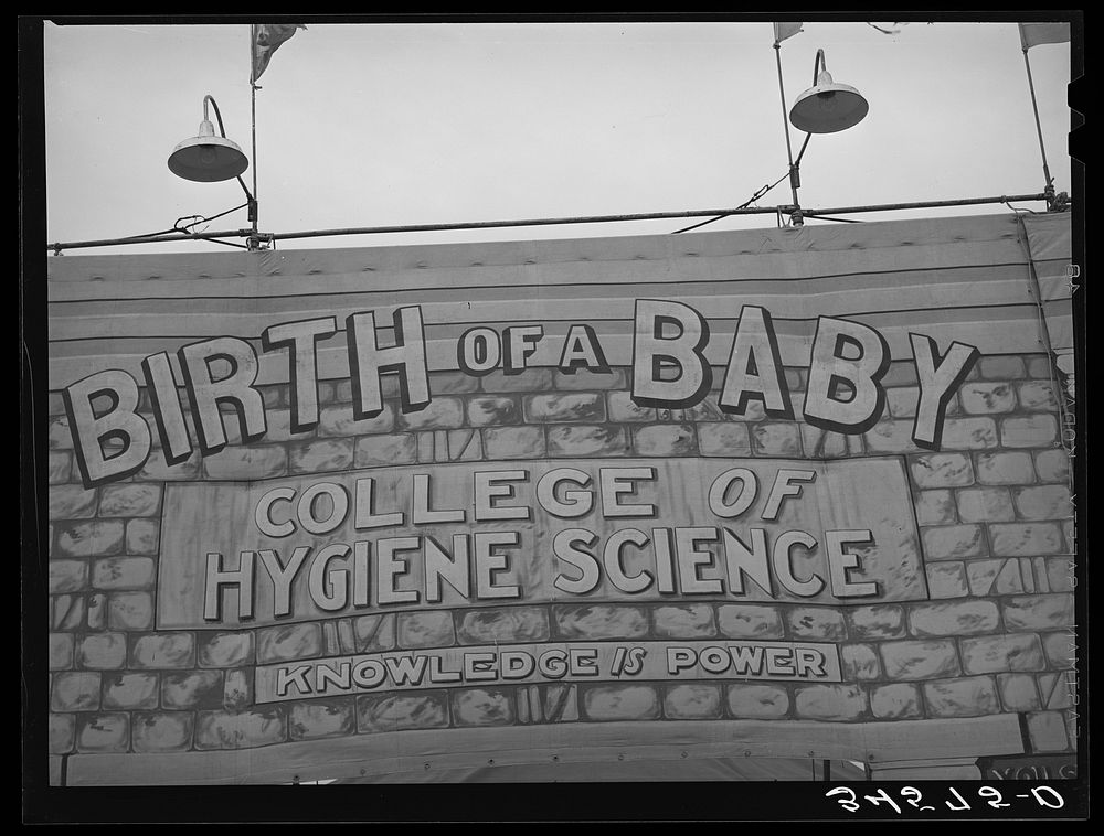 Sign at sideshow at Gonzales, Texas county fair. Gonzales, Texas by Russell Lee