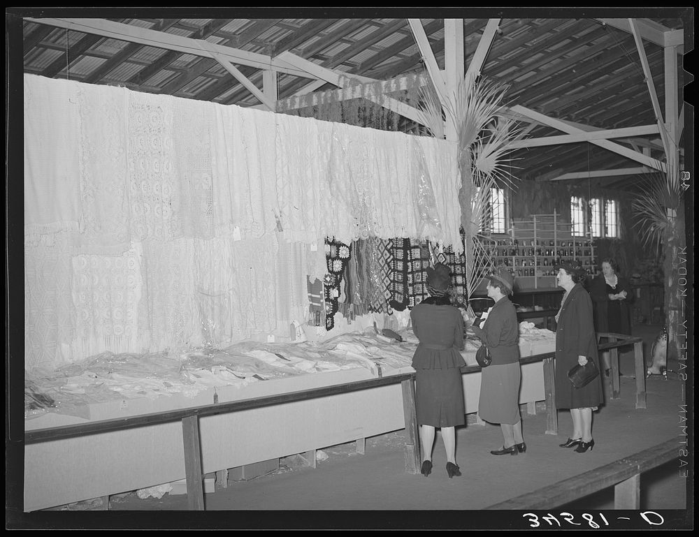 Women looking at knitting exhibit at Gonzales County Fair. Gonzales, Texas by Russell Lee