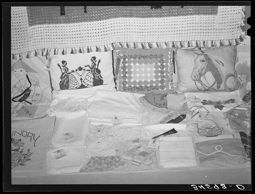 [Untitled photo, possibly related to: Exhibit of needle work at Gonzales County Fair. Gonzales, Texas] by Russell Lee
