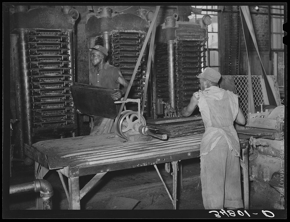 Action around the hydraulic presses. Cotton seed oil mill. McLennan County, Texas by Russell Lee