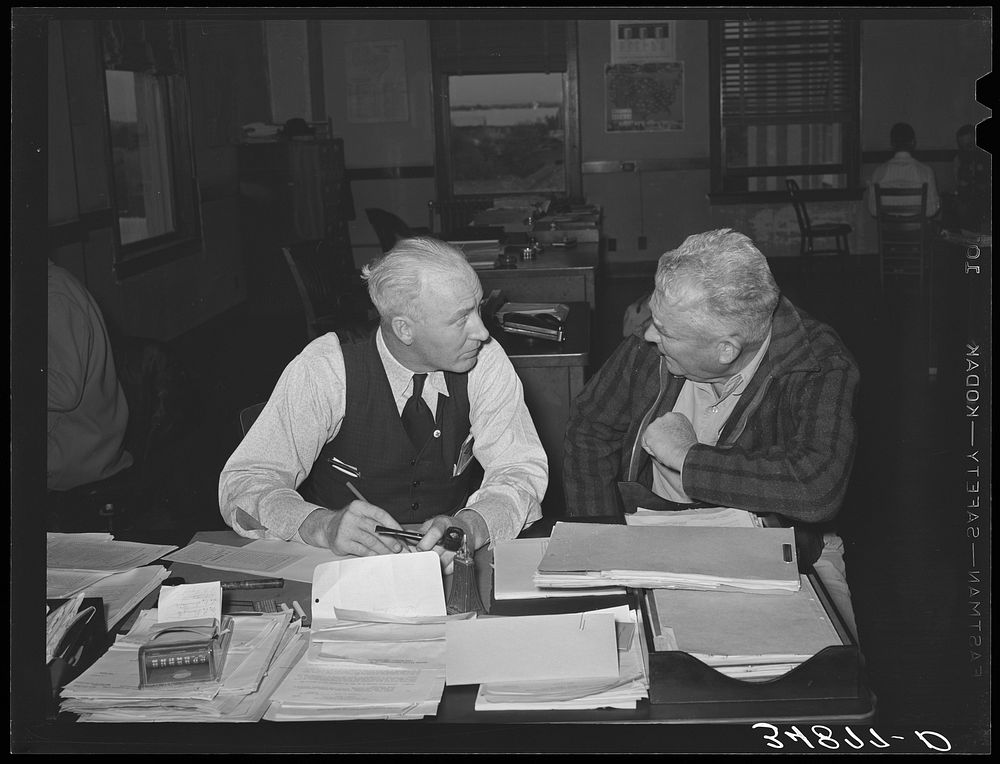 County FSA (Farm Security Administration) supervisor talking with client. San Angelo, Texas by Russell Lee