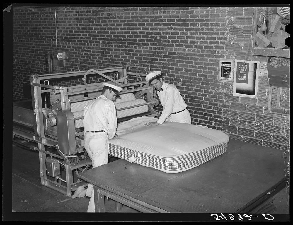 Filling mattress case with cotton linters. Mattress factory. San Angelo, Texas by Russell Lee