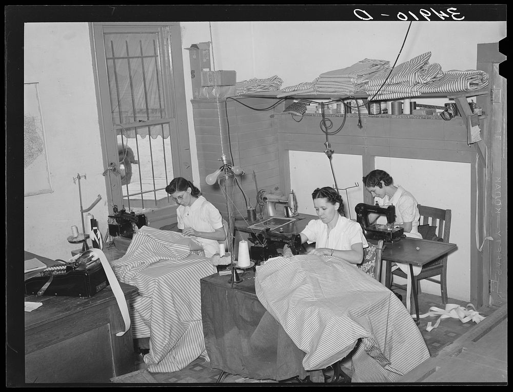 Sewing mattress ticking. Mattress factory. San Angelo, Texas by Russell Lee